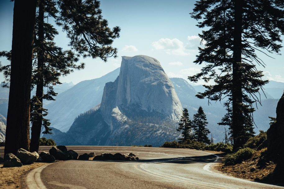 half dome viewed from a road - Trent Erwin | Unsplash